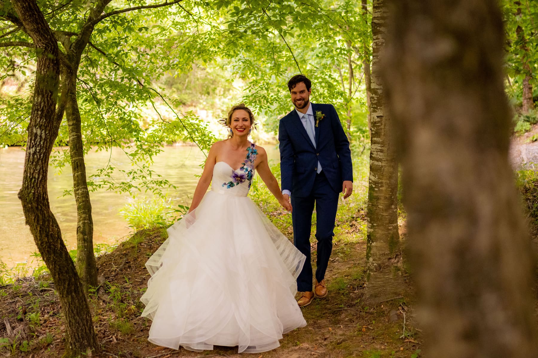 Couple walking together through the trees