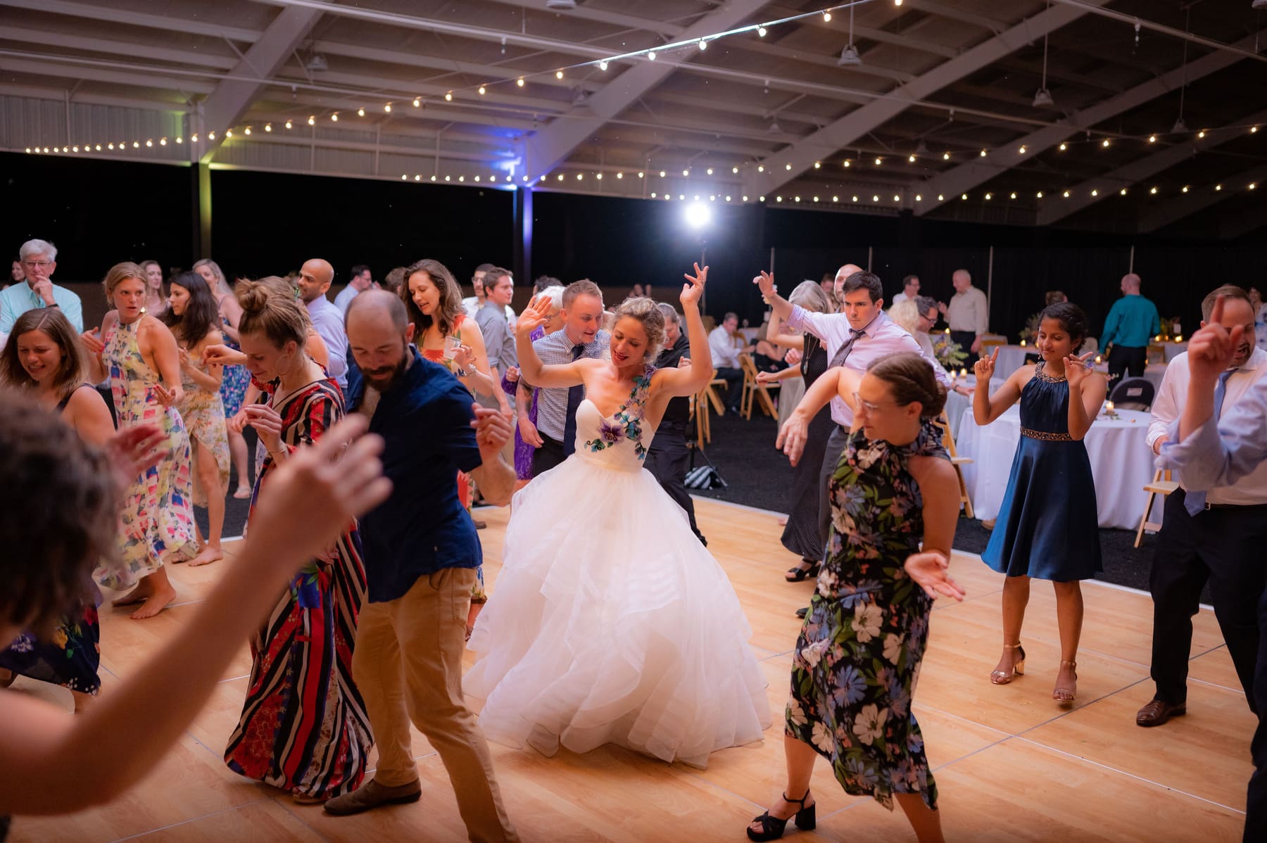 Night dancing under string lights