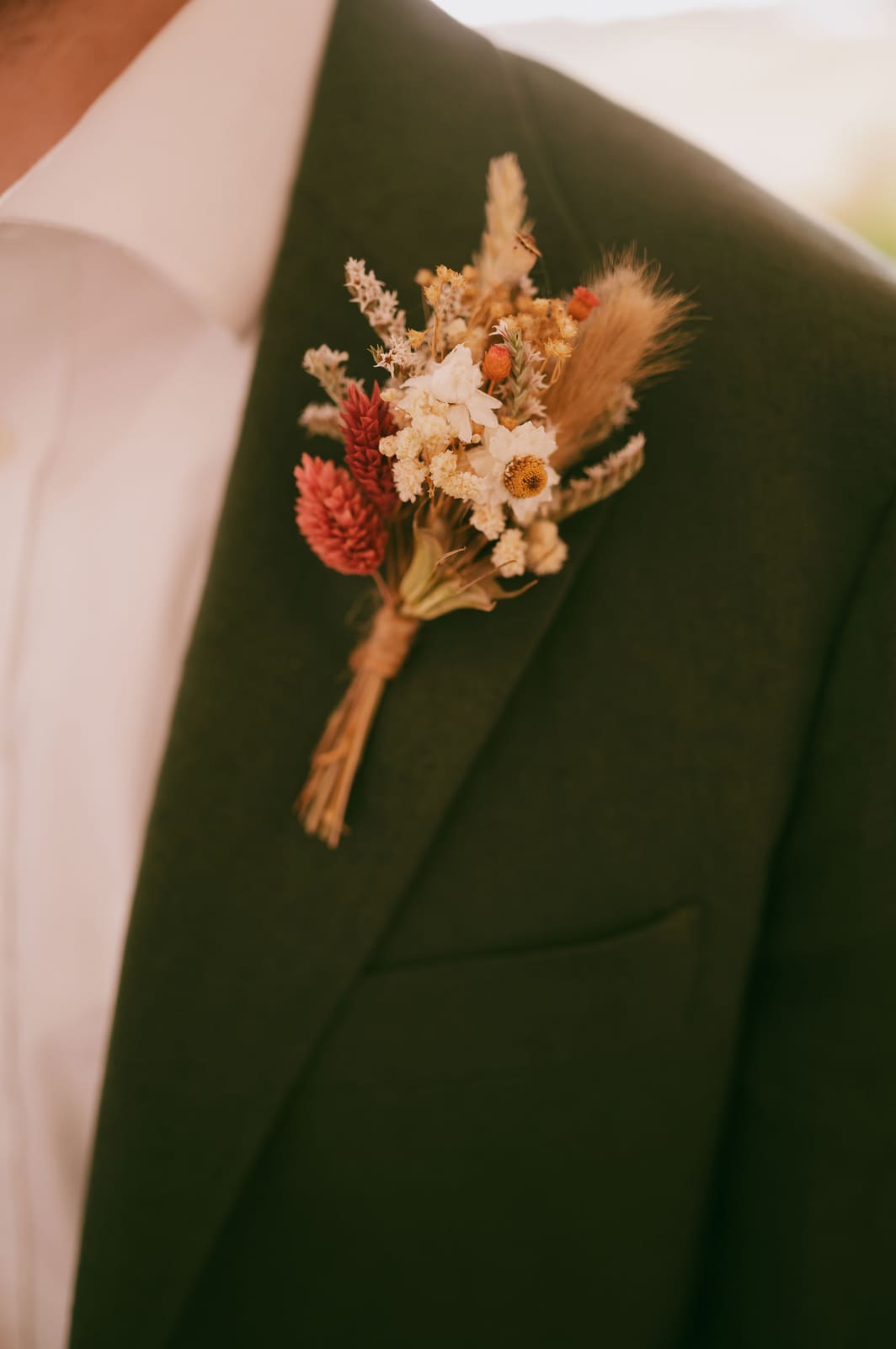 Close-up of the groom's boutonniere