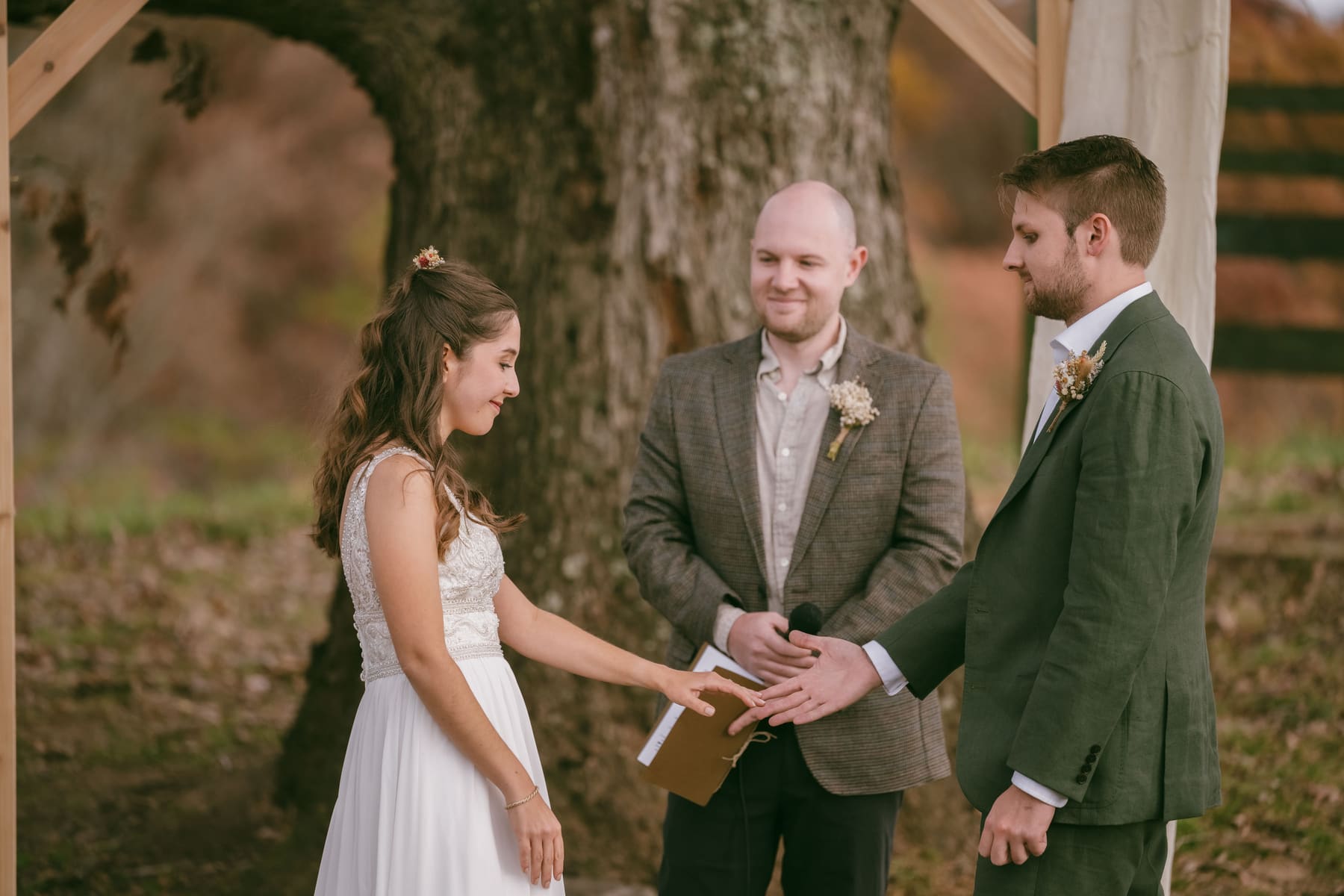 Robin and Jacob holding hands during vows