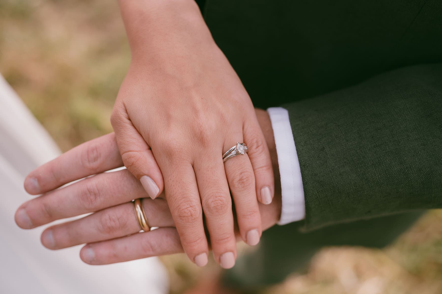 Close-up of wedding rings and hands