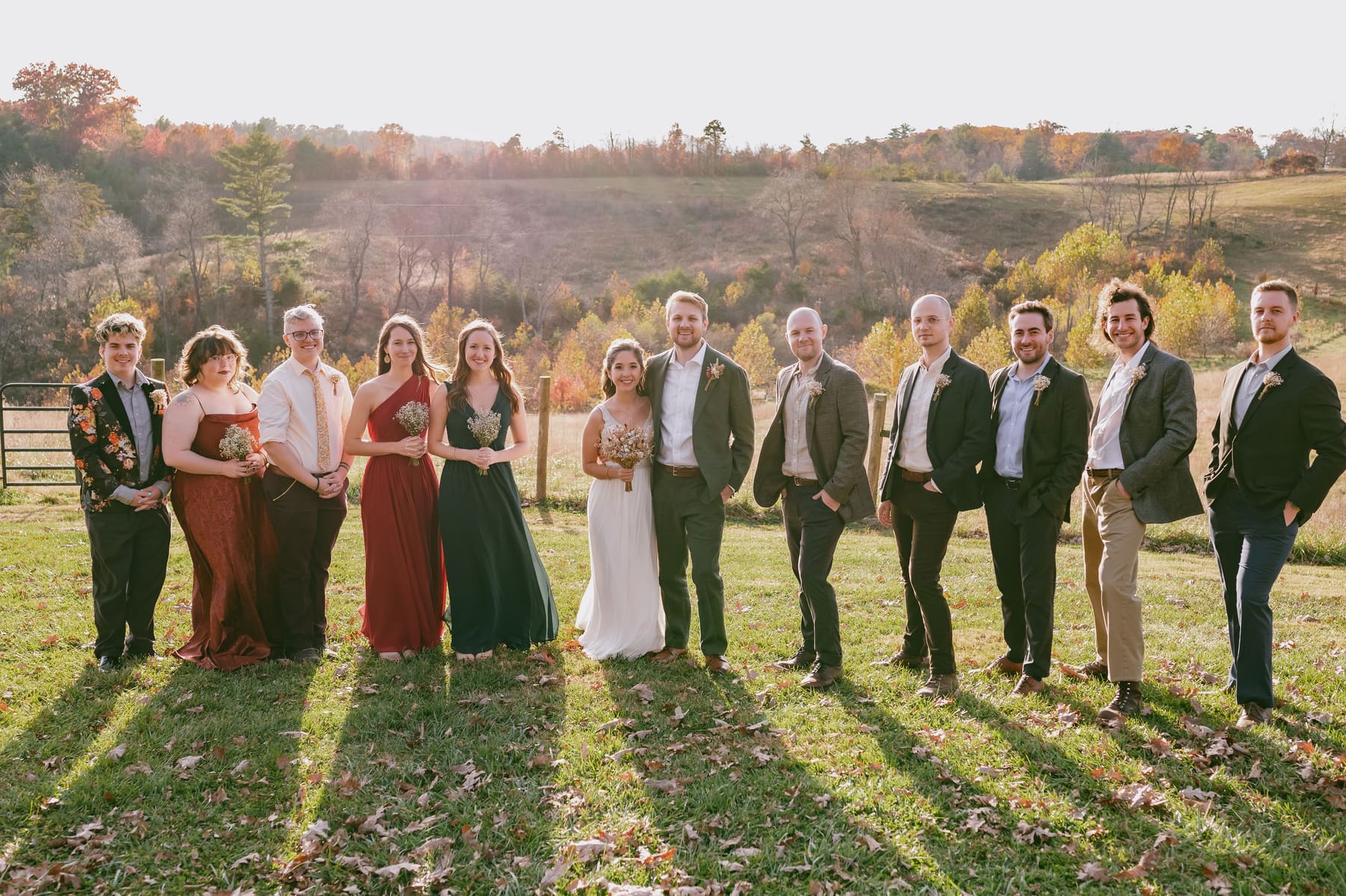 Full wedding party portrait at golden hour