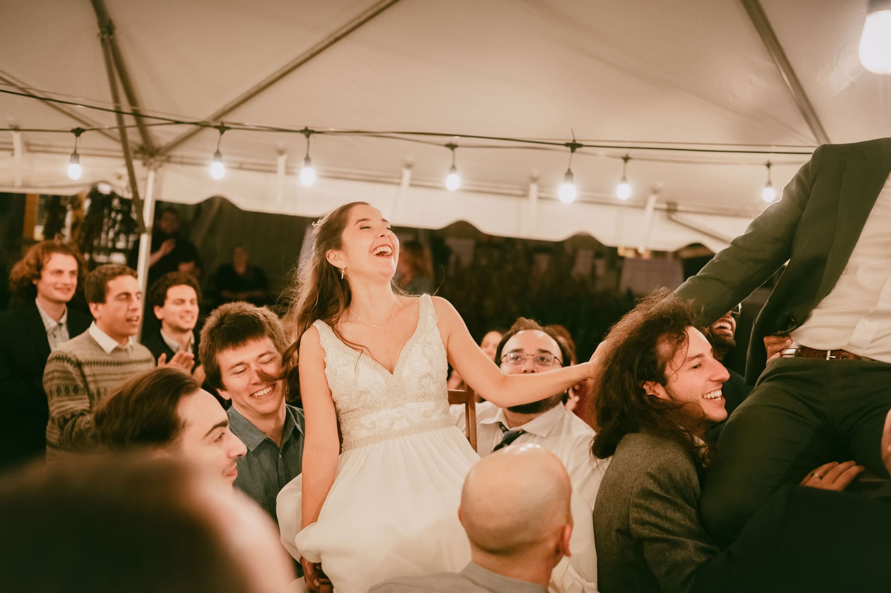 Reception celebration under string lights